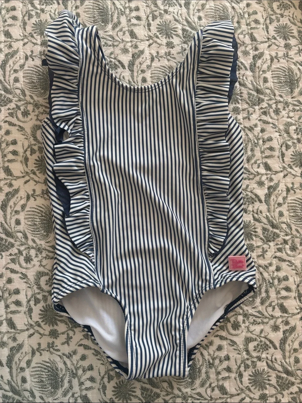 Ruffle Butts Navy and White Striped Ruffle One-Piece with Pink Logo